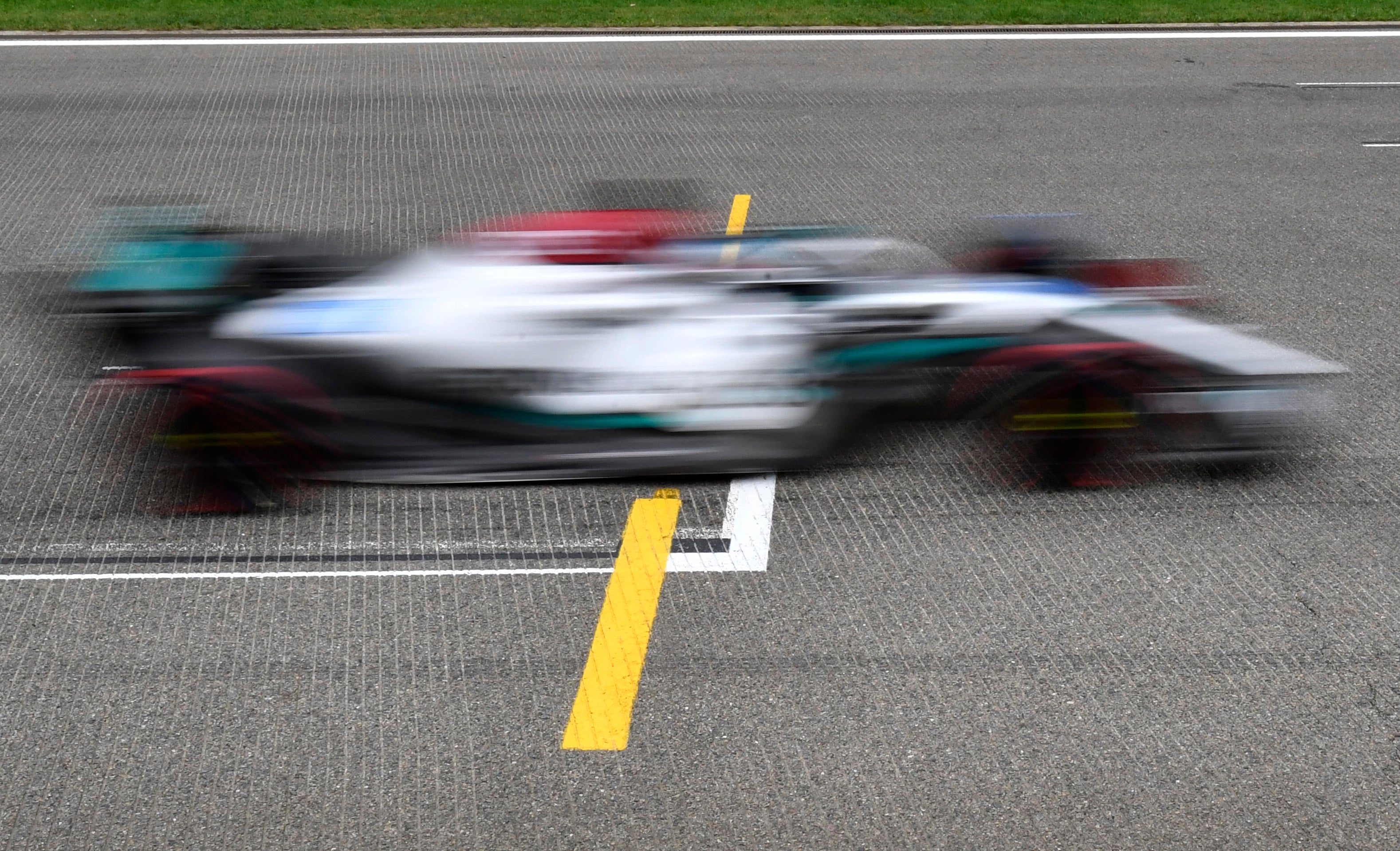 Lewis Hamilton qualified seventh but will start from fourth on the grid (Geert Vanden Wijngaert/AP)