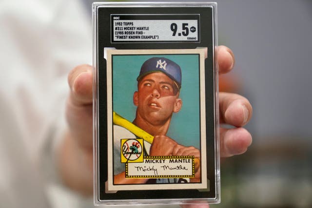 <p>A ‘miracle’ Mickey Mantle baseball card become the most valuable piece of sports memorabilia sold at auction</p>