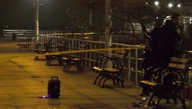 <p>Crime scene tape on the Coney Island boardwalk after the shooting</p>