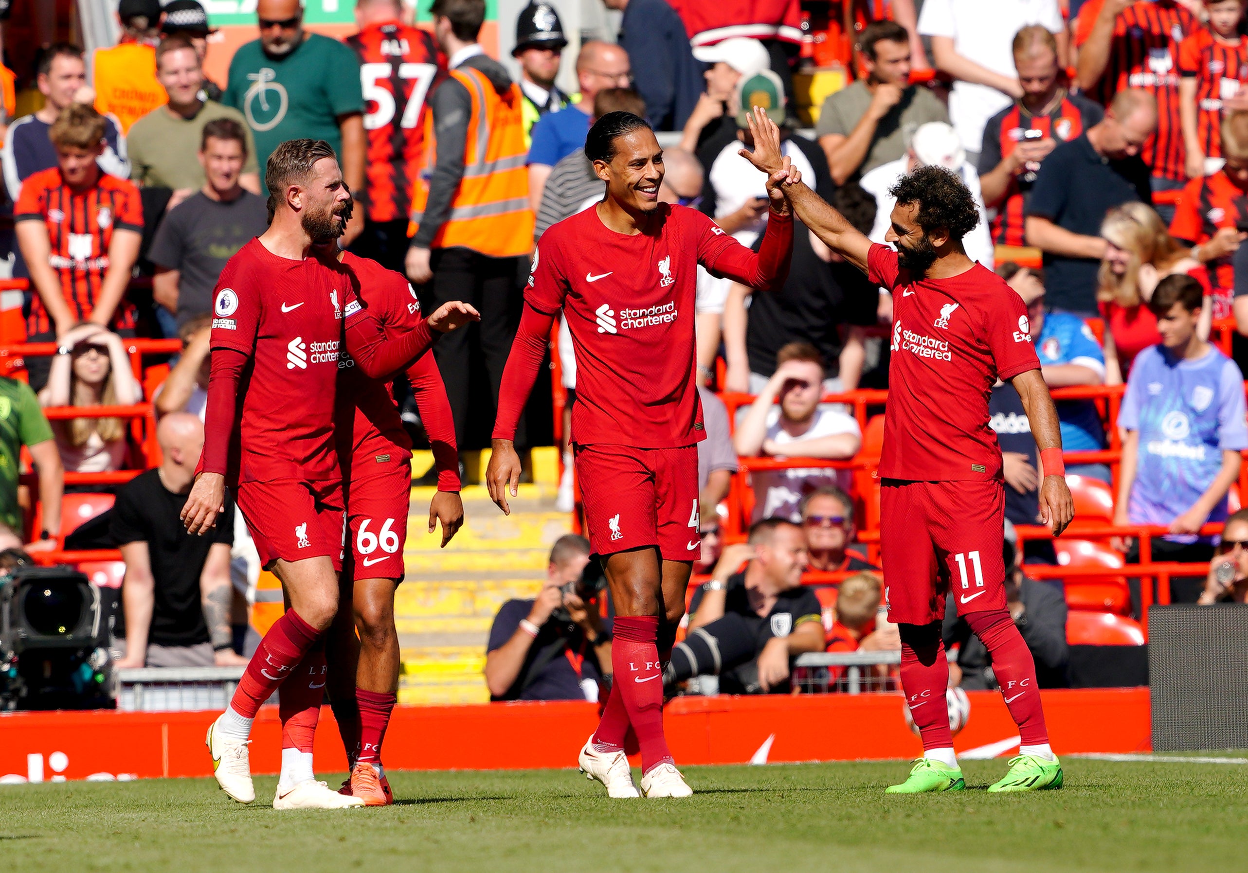 Virgil van Dijk (centre) hopes Liverpool can ‘crack on’ (Peter Byrne/PA)