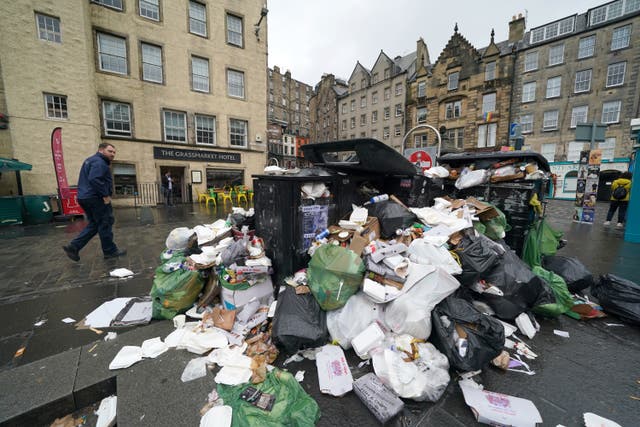 Overflowing bins in the Grassmarket area of Edinburgh (Andrew Milligan/PA)