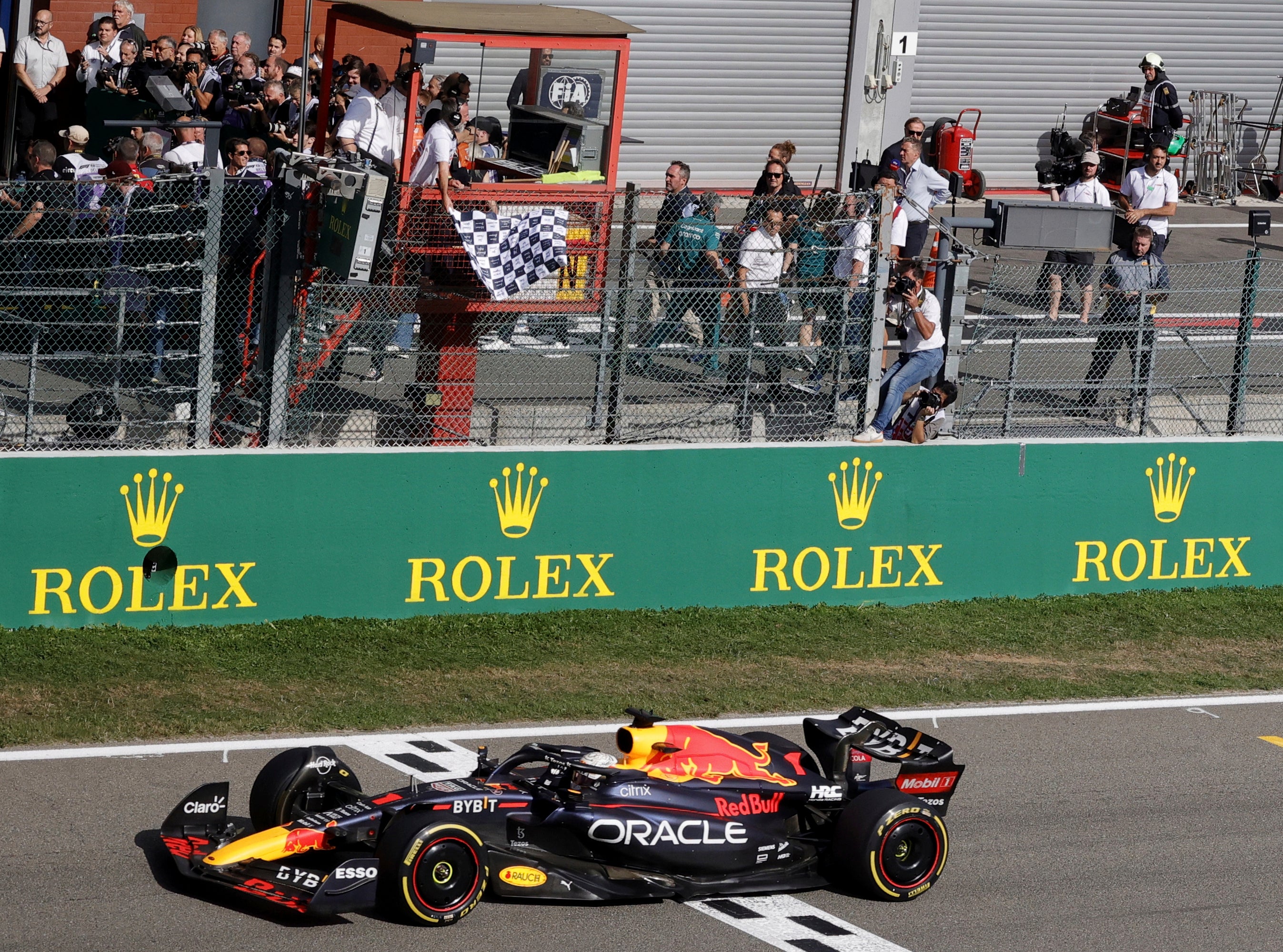 Max Verstappen crossed the line nearly 18 seconds clear of Sergio Perez in Belgium (Olivier Matthys/AP)