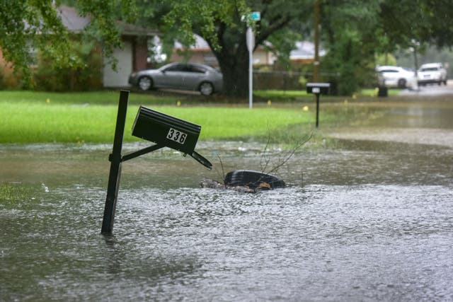 <p>A mailbox stands in floodwaters from heavy rains in northeast Jackson, Mississippi, on Wednesday</p>