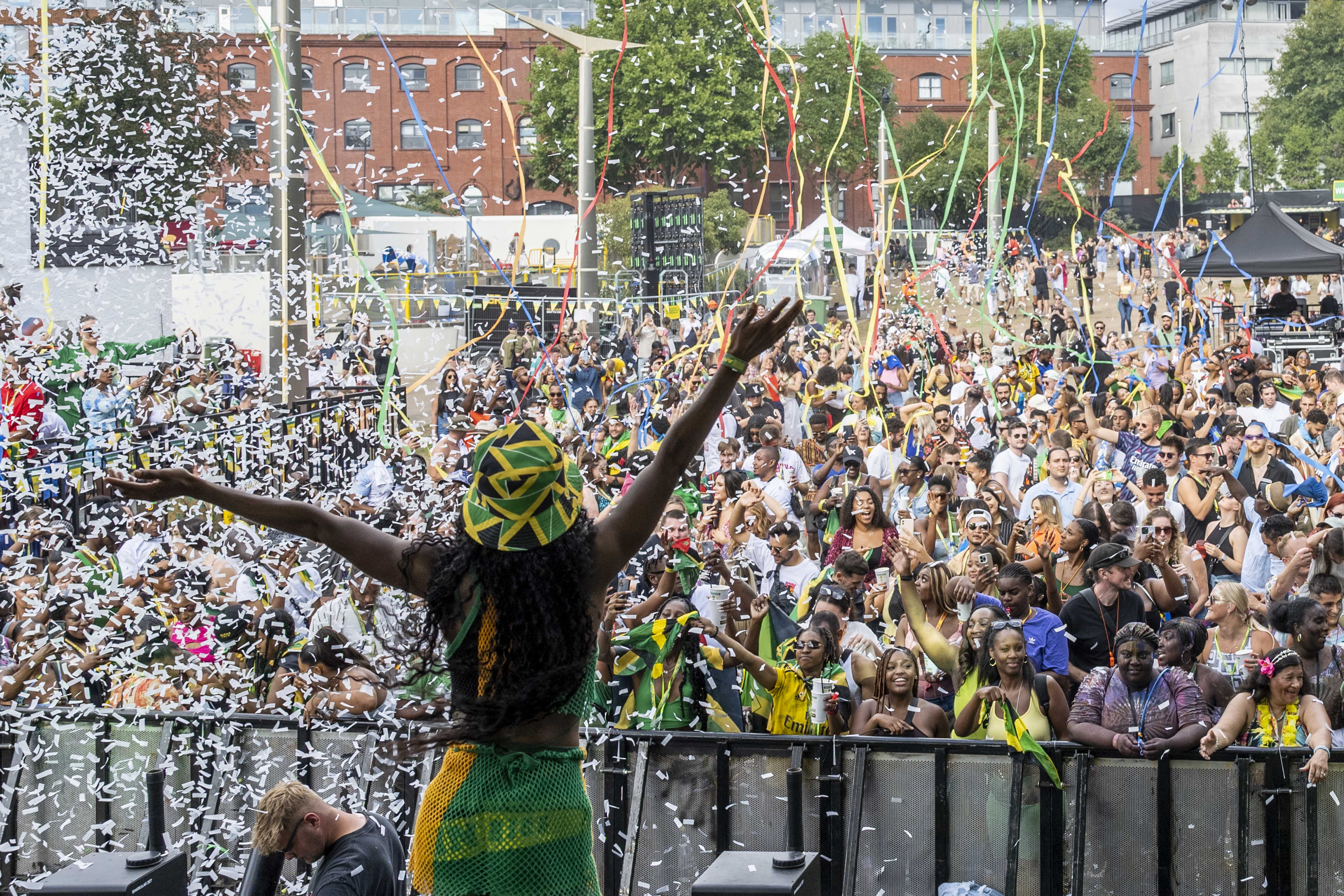 Confetti rains down over the crowds at the Wray & Nephew stage at the Emslie Horniman’s Pleasance Park