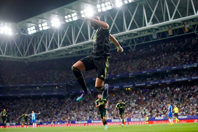 Real Madrid’s Karim Benzema celebrates after scoring his side’s third goal at Espanyol (Joan Mateu Parra/AP)