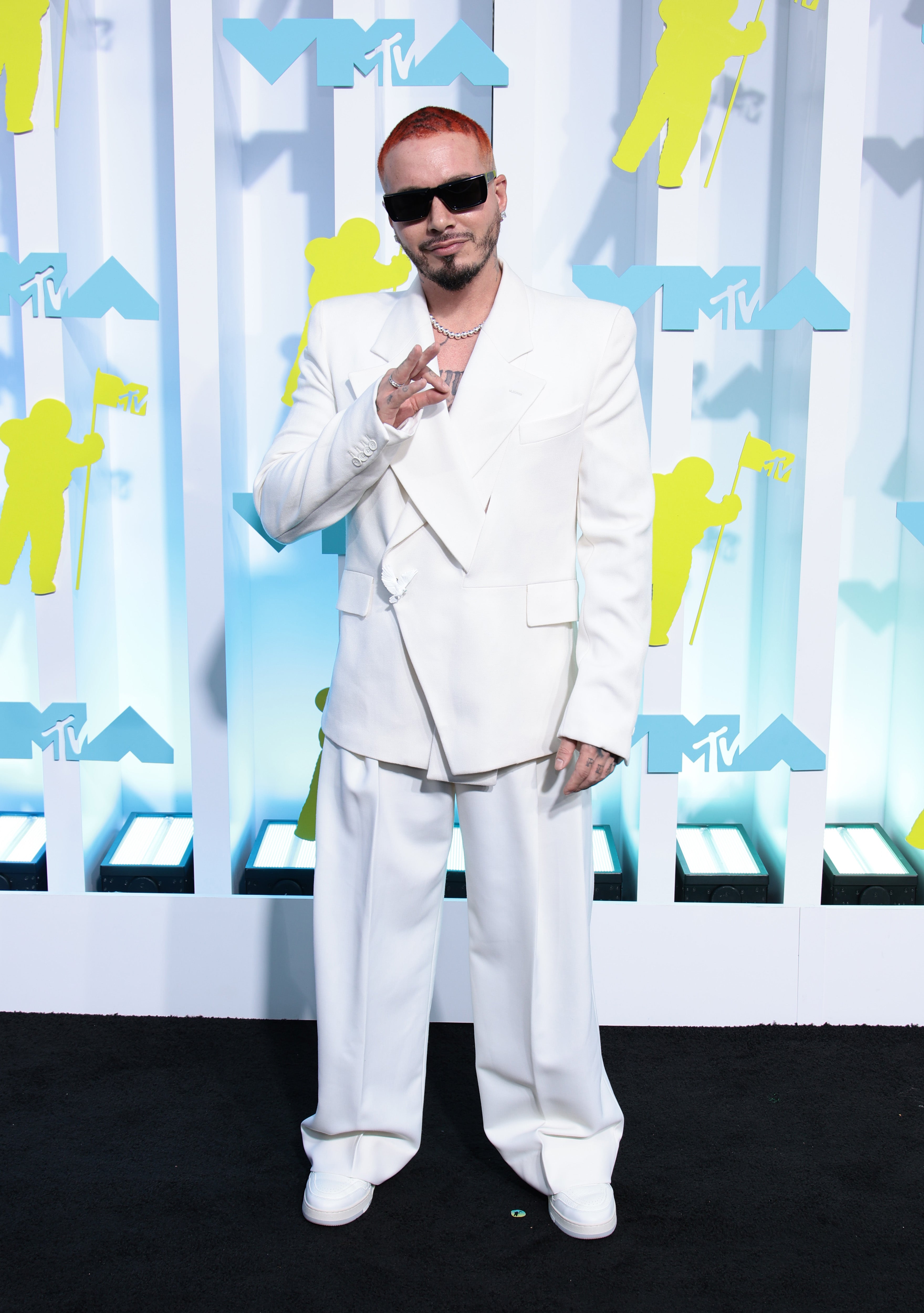 Singer J Balvin wears a blue denim vest, a white t-shirt, sunglasses,  News Photo - Getty Images