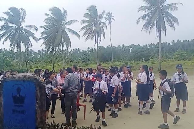 <p>School students and staff gather in an open area after a magnitude 6.1 earthquake struck near Mentawai Islands (Facebook/Doniman Aro Harefa/via REUTERS)</p>