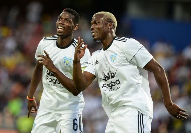 <p>Mathias Pogba (right) celebrates with his brother Paul during a friendly match in 2017 </p>