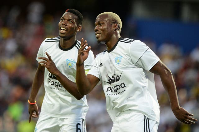 <p>Mathias Pogba (right) celebrates with his brother Paul during a friendly match in 2017 </p>