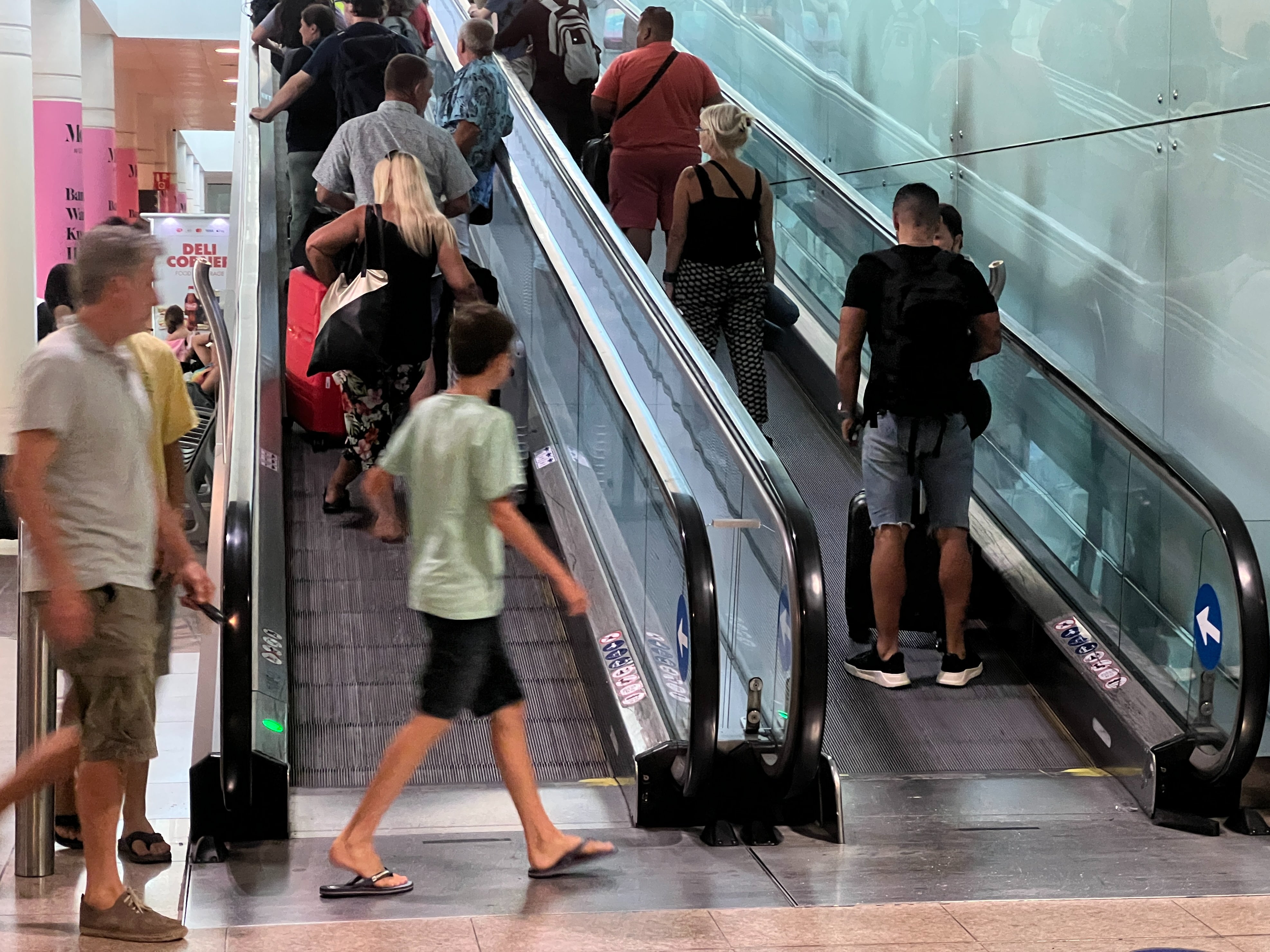 Homeward bound: Passengers at Barcelona airport