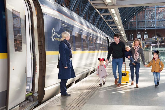 <p>Dream destination: Disneyland Paris passengers boarding a Eurostar train at London St Pancras International</p>