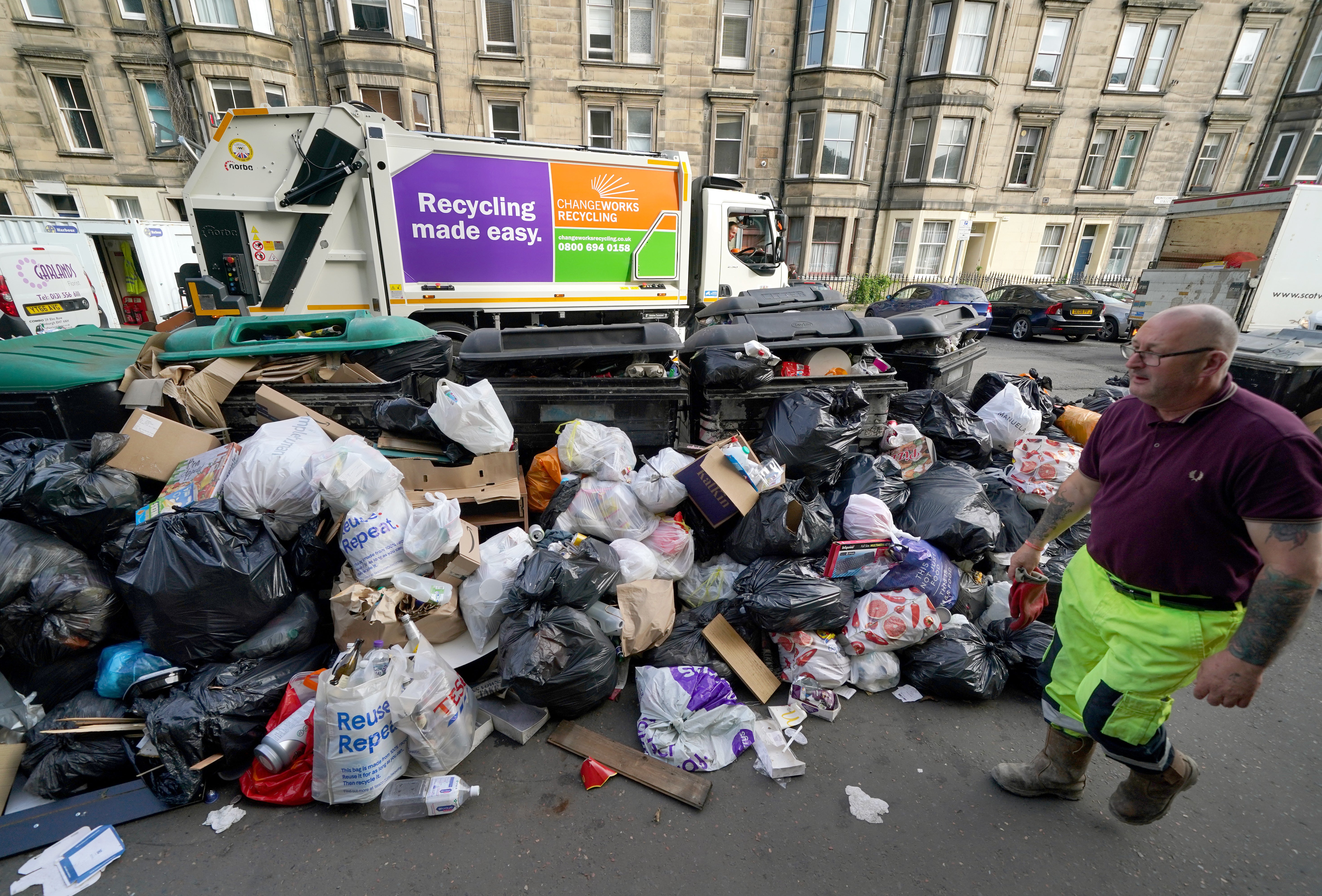 Bins in Edinburgh have been overflowing as a result of recent action (Andrew Milligan/PA)