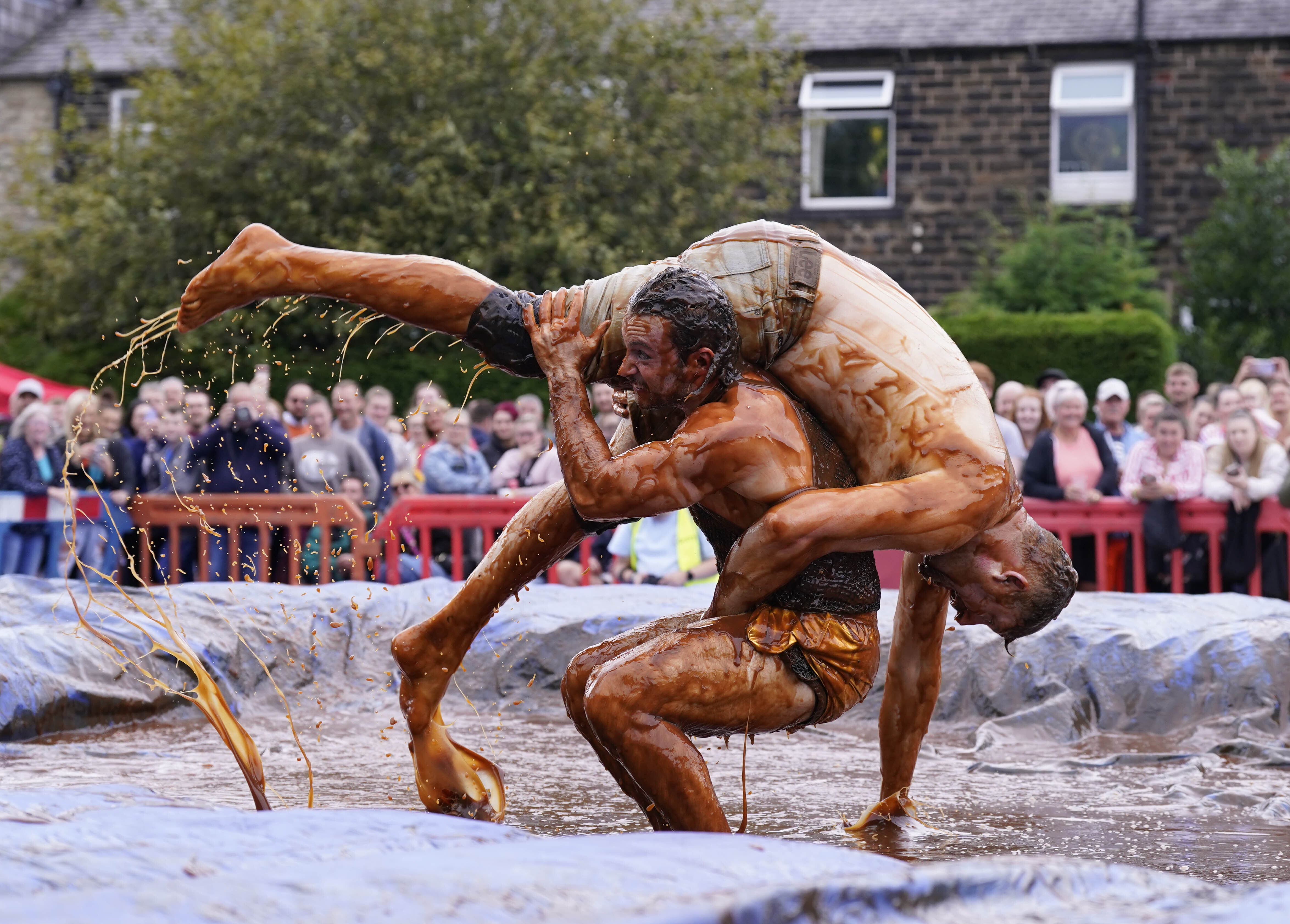 Wrestlers have two minutes to defeat their opponent at the annual event, which an organiser admitted is ‘smelly’ (Danny Lawson/PA)