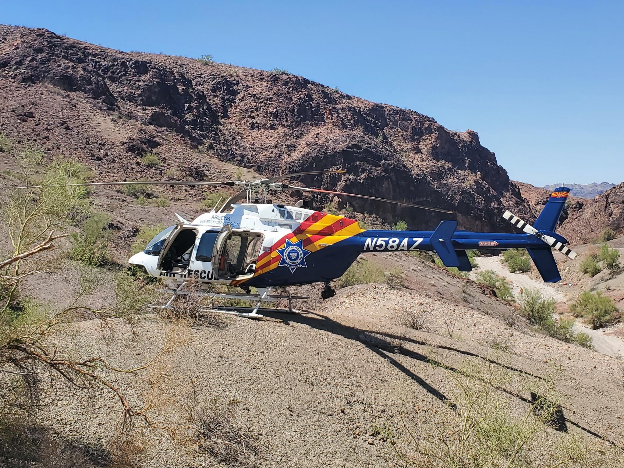 A helicopter involved in the search for hikers near Lake Havasu City. A man in Laguna Niguel, California is in custody after attempting to shoot at an Orange County Sheriff’s Department helicopter
