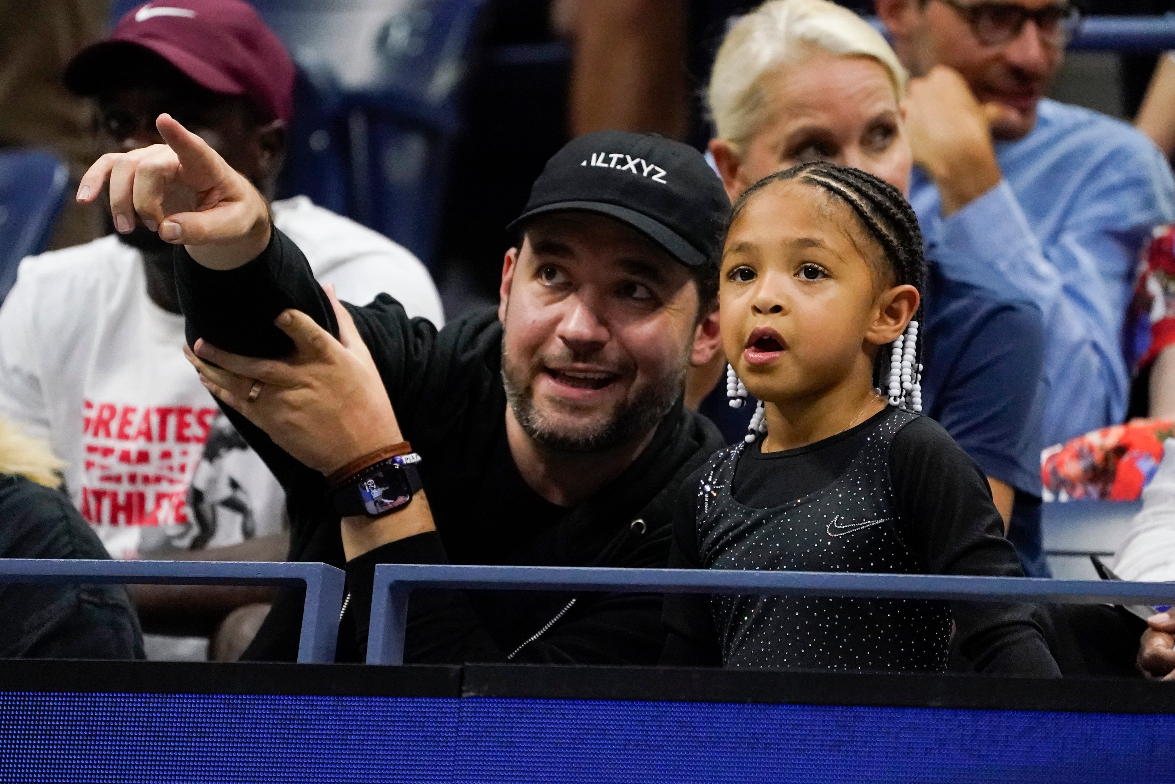 Ohanian and Olympia watch from the stands (John Minchillo/AP)
