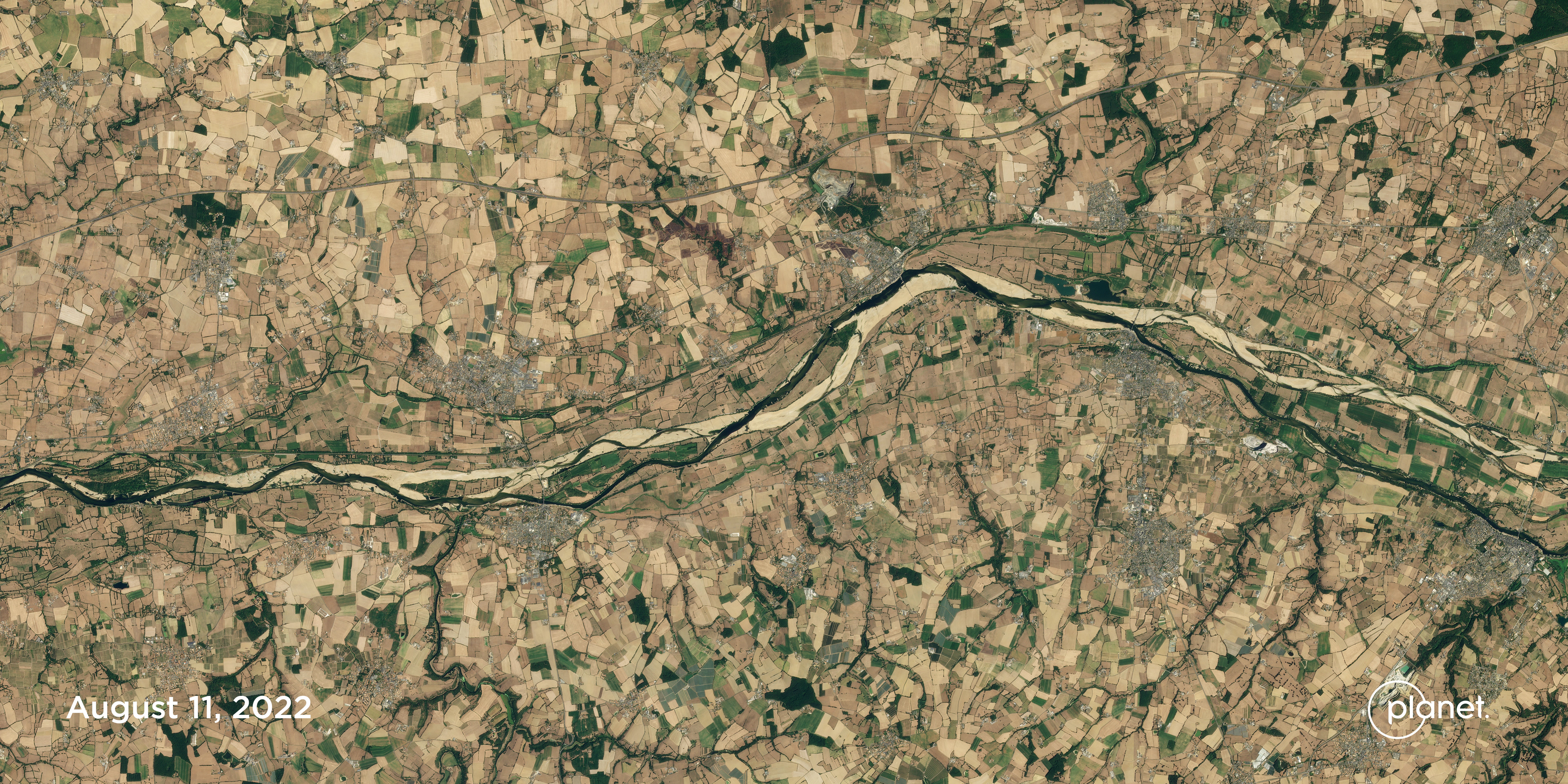 Low river levels and dry fields along the Loire River near Saint-Florent-le-Vieil, France