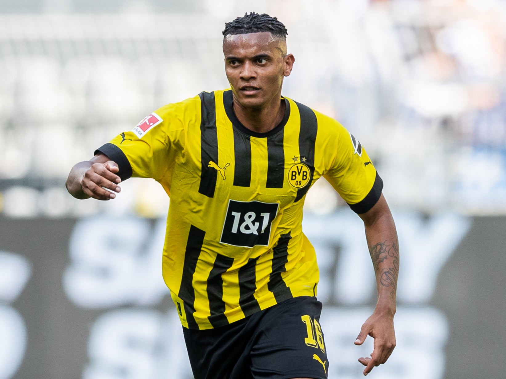  Manuel Akanji, a Swiss professional soccer player who plays for Bundesliga club Borussia Dortmund and the Switzerland national team, is seen playing soccer.