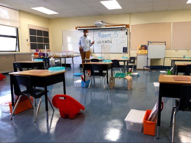 <p>Bryant Elementary School kindergarten teacher Chris Johnson sets up his classroom on April 09, 2021 in San Francisco, California</p>