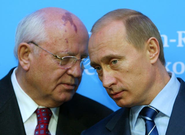<p>Russian President Vladimir Putin (R) listens to former President of the Soviet Union Mikhail Gorbachev during a 2004 news conference in Germany. </p>