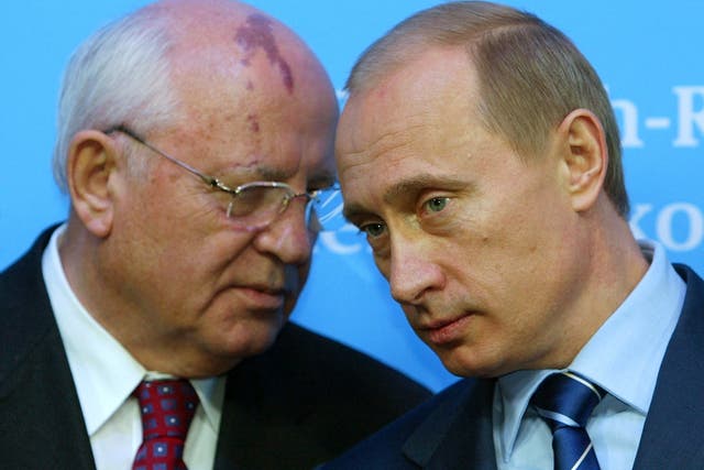 <p>Russian President Vladimir Putin (R) listens to former President of the Soviet Union Mikhail Gorbachev during a news conference following bilateral talks with German Chancellor Gerhard Schroeder at Schloss Gottorf Palace in the northern German town of Schleswig, Germany December 21, 2004</p>