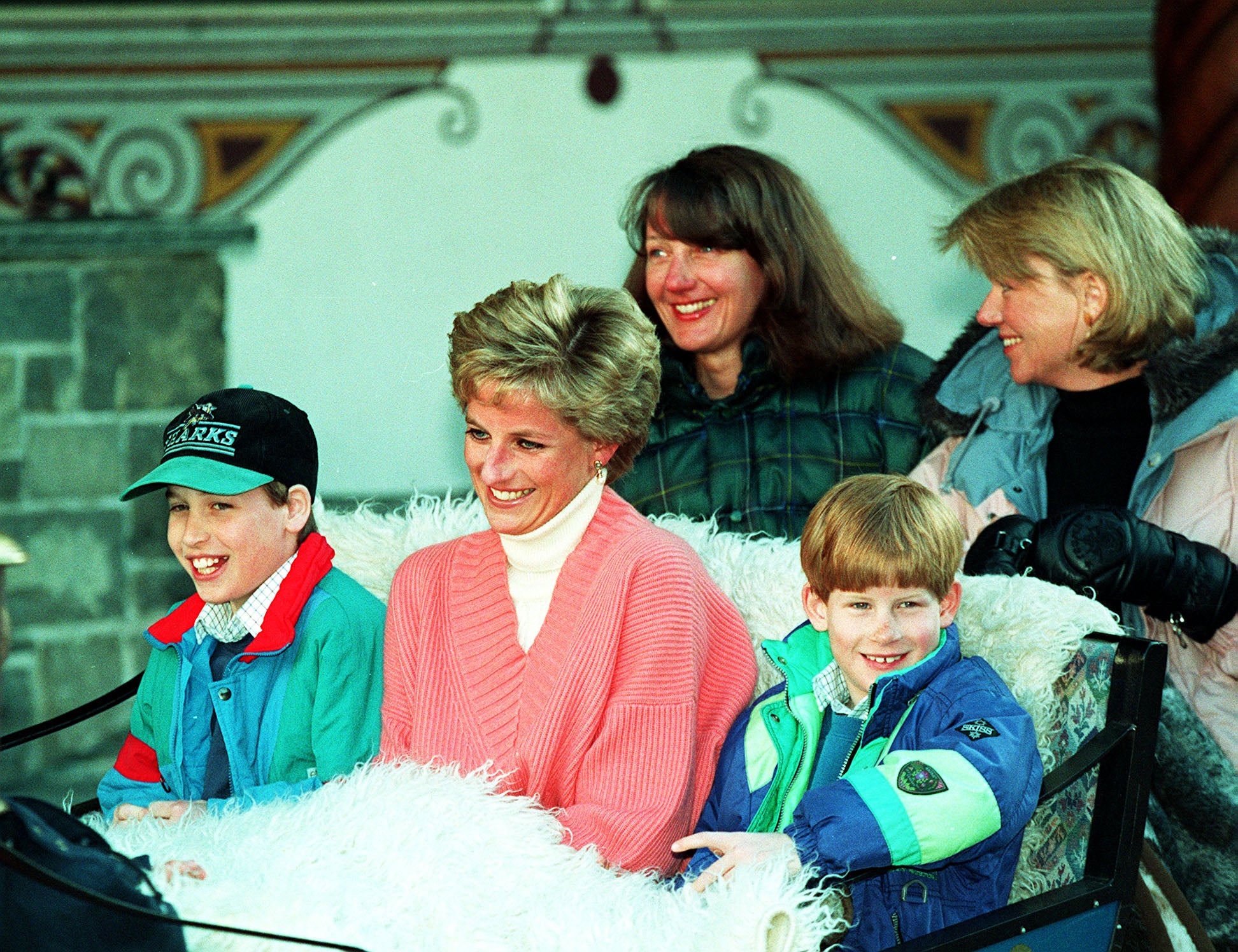 The Princess of Wales with her two sons William (left) and Harry riding in a horse-drawn sleigh in 1994 (Martin Keene/PA)
