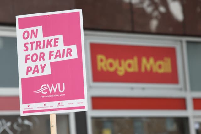 Postal workers from the Communication Workers Union on the picket line at an earlier Royal Mail strike (PA)