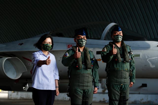 <p>Taiwan's president Tsai Ing-wen poses next to Air Force pilots during her visit to Penghu, Taiwan</p>