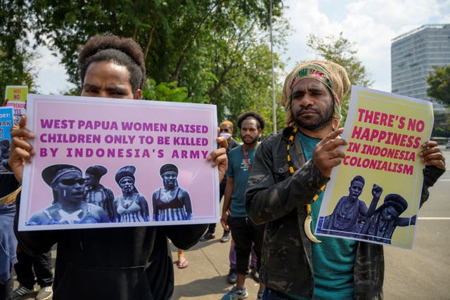 <p>Papuan students show posters during a protest in front of the US embassy in Jakarta demanding the US take responsibility for the signing of the New York agreement between the Netherlands and Indonesia which handed Papua over to Indonesia on 15 August 1962 </p>