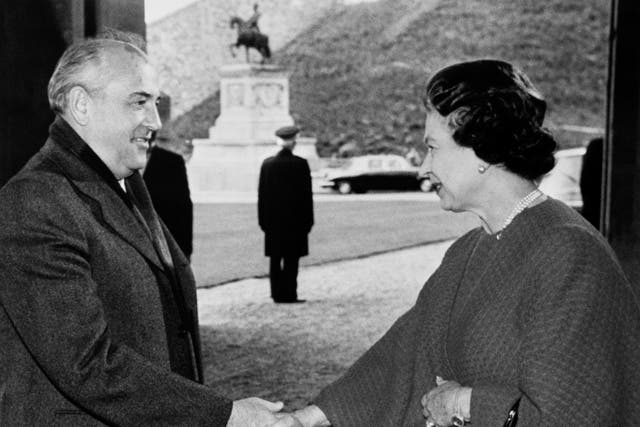 <p>Soviet President Mikhail Gorbachev is greeted by the Queen at the entrance to Windsor Castle (PA)</p>