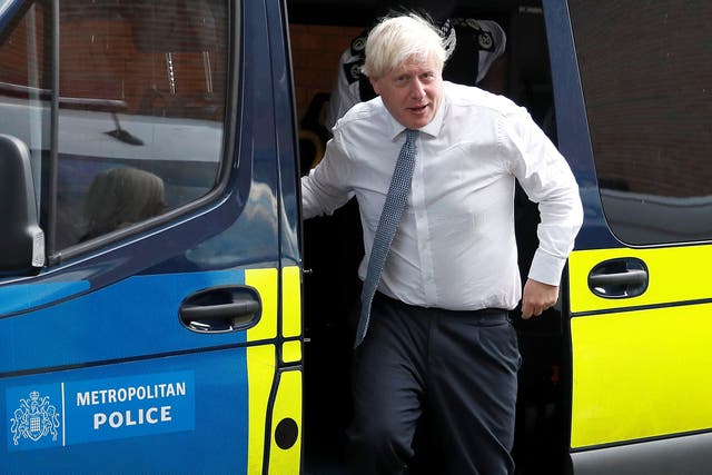 Prime Minister Boris Johnson leaves a police vehicle after watching a drugs-related raid by Metropolitan Police officers (Peter Nicholls/PA)