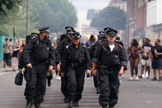 <p>Police officers at Notting Hill carnival </p>