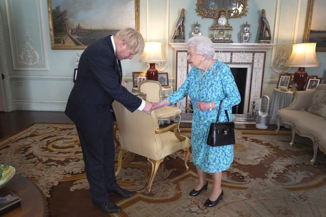The Queen welcomes newly elected leader of the Conservative party Boris Johnson during an audience in Buckingham Palace, where she invited him to become Prime Minister and form a new government (Victoria Jones/PA)