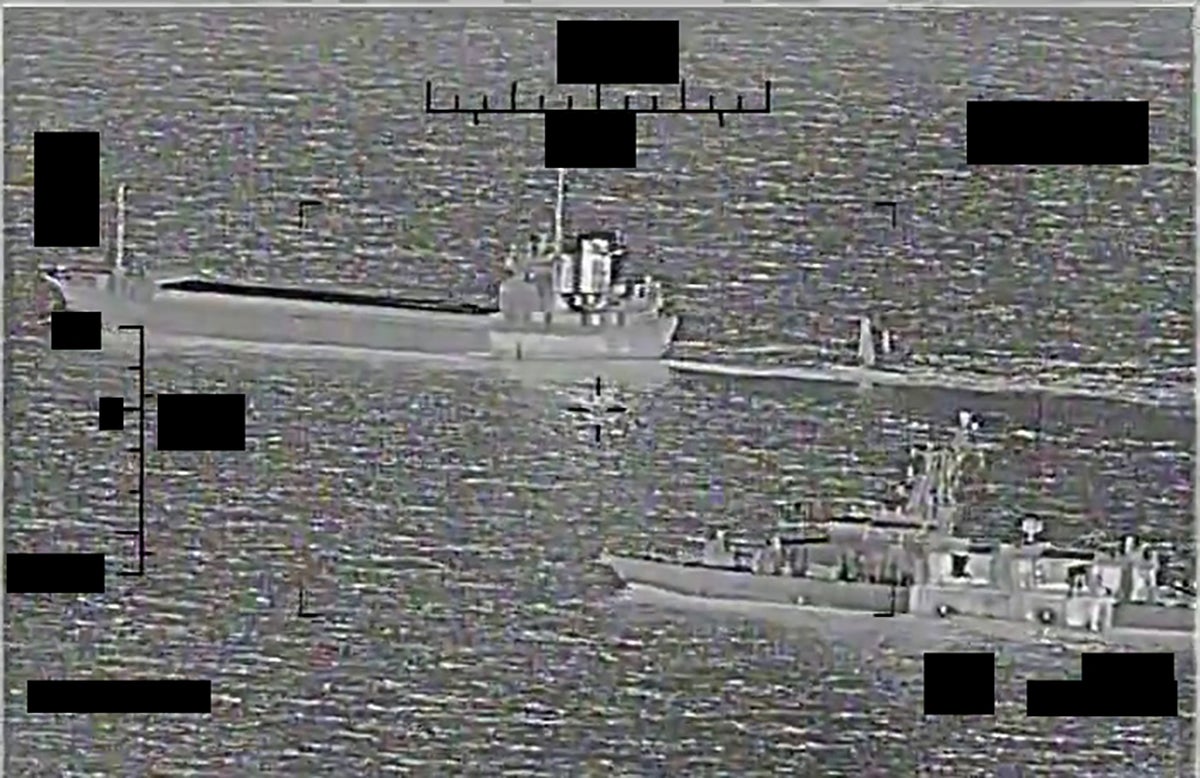 Screenshot of a video showing support ship Shahid Baziar, left, from Iran's Islamic Revolutionary Guard Corps Navy unlawfully towing a Saildrone Explorer unmanned surface vessel in international waters of the Arabian Gulf as U.S. Navy patrol coastal ship USS Thunderbolt (PC 12) approaches in response.