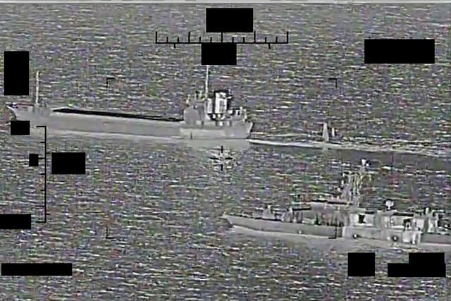 <p>Screenshot of a video showing support ship Shahid Baziar, left, from Iran's Islamic Revolutionary Guard Corps Navy unlawfully towing a Saildrone Explorer unmanned surface vessel in international waters of the Arabian Gulf as U.S. Navy patrol coastal ship USS Thunderbolt (PC 12) approaches in response. </p>