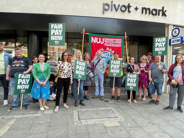 Staff and supporters outside the Bristol Post’s co-working space (Tess de la Mare/PA))