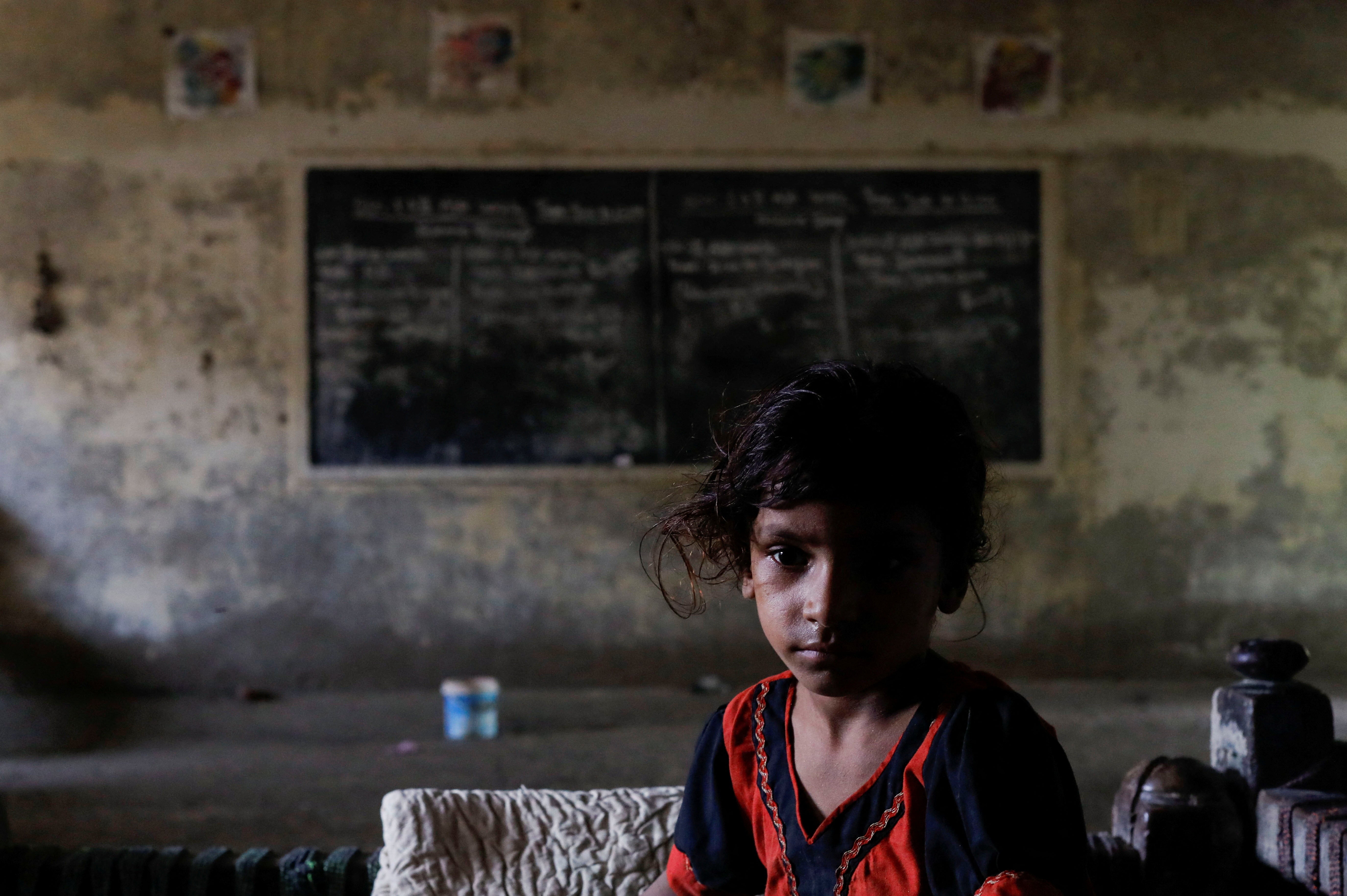 Five year-old Dua, who along with her family is displaced by flooding, takes refuge in a school, following rains and floods during the monsoon season in Jacobabad, Pakistan on Tuesday.