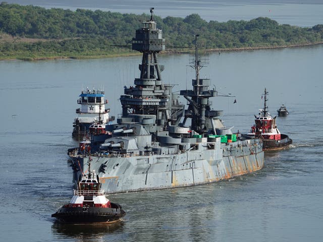 <p>The USS Texas was towed down the Houston Ship Channel on Wednesday on its way to repair work in Galveston, Texas</p>