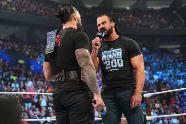 <p>Drew McIntyre faces off with Roman Reigns</p>