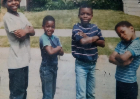 Lorenzo Harrell (left) with family members as a child