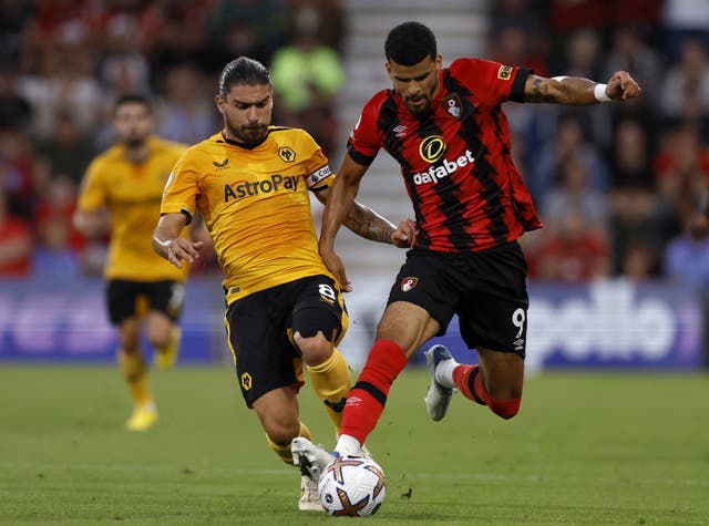Ruben Neves makes a tackle on Bournemouth’s Dominic Solanke (Steven Paston/PA)