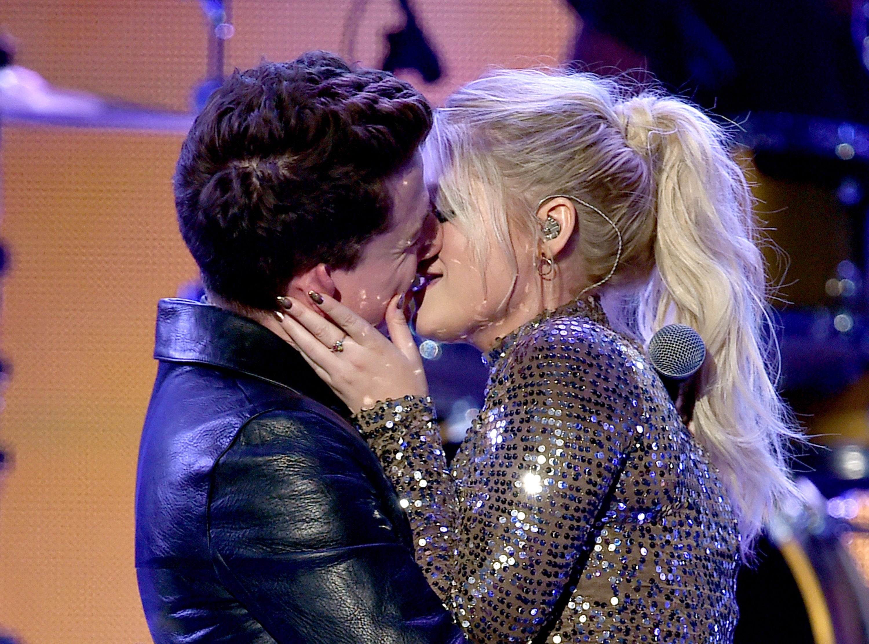Charlie Puth and Meghan Trainor kiss onstage at the 2015 American Music Awards