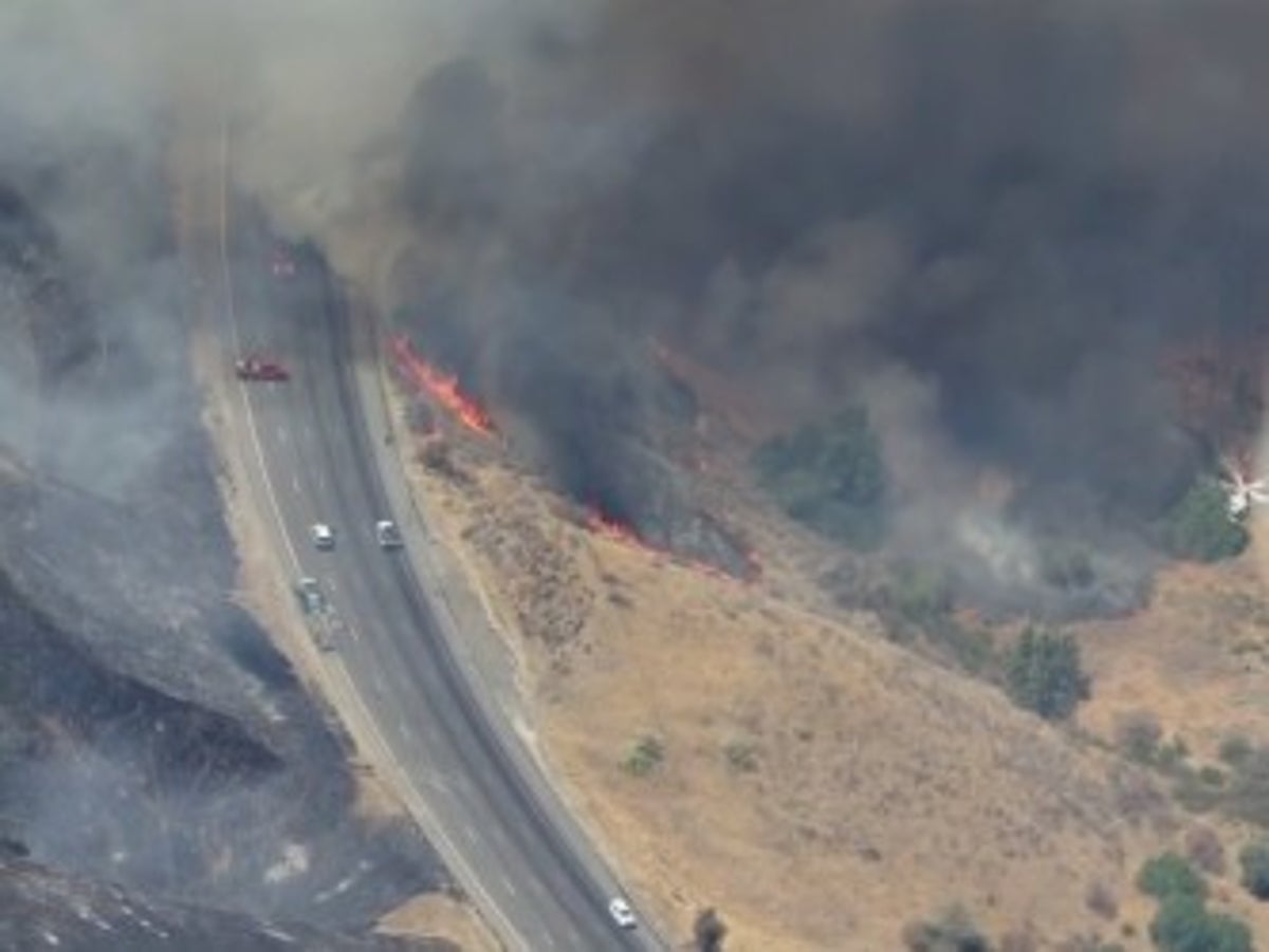California freeway near Los Angeles shutdown by wildfire as heatwave scorches state