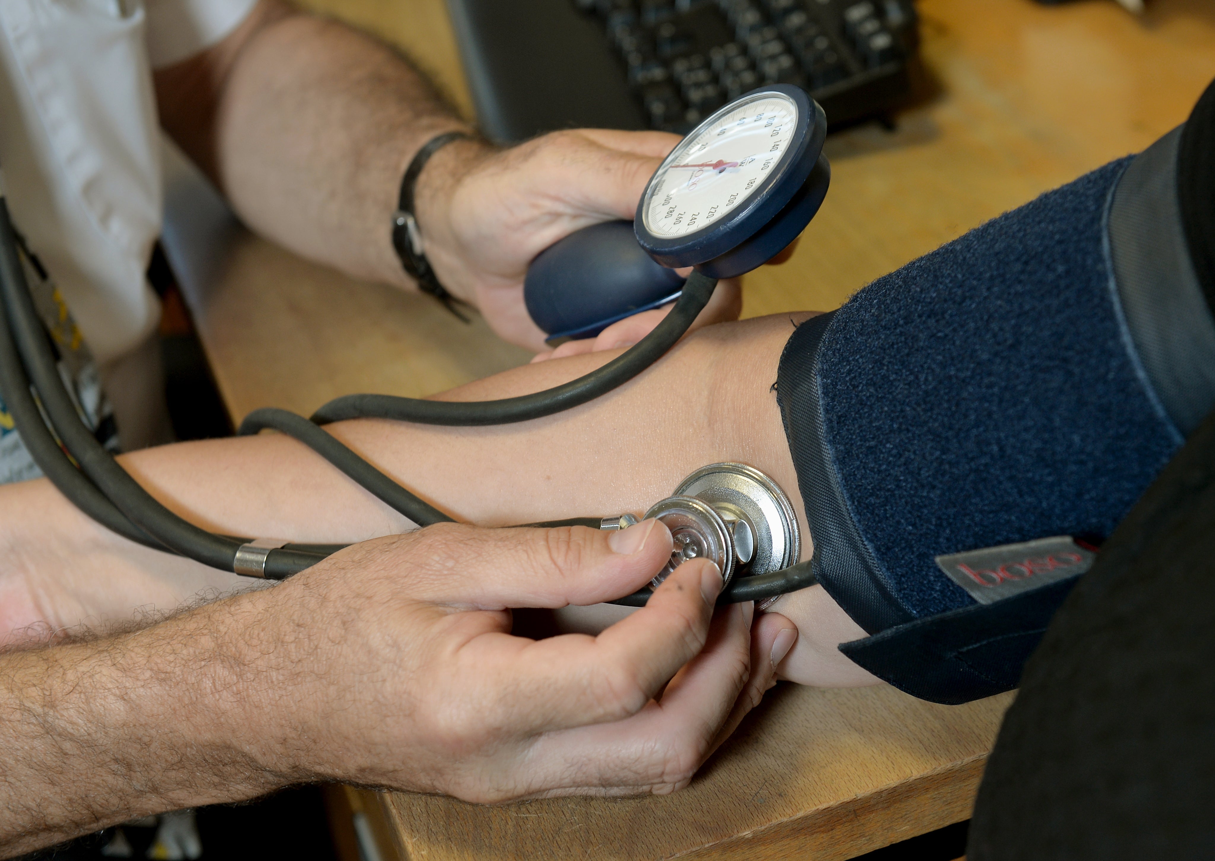 A doctor checking a patient’s blood pressure, as over half of UK adults cannot name a single symptom of blood cancer despite it being the third biggest cancer killer in the UK, polling for Blood Cancer UK suggests (Anthony Devlin/PA)
