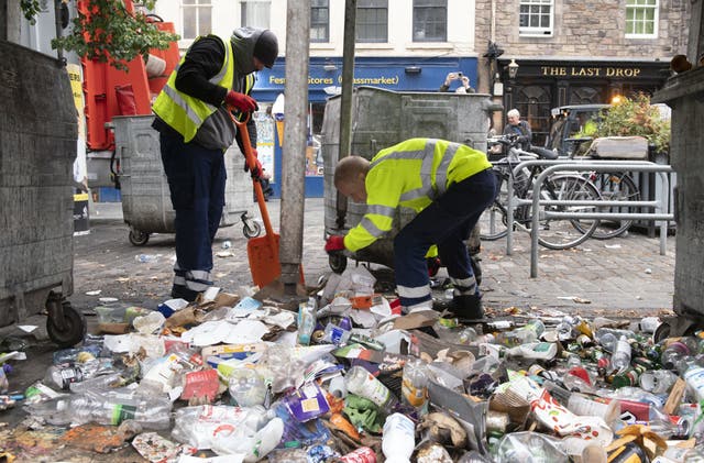 Clean-up operations have begun as waste staff across Scotland return to work (Lesley Martin/PA)