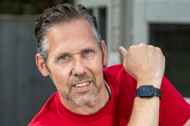 <p>David Last with the Apple watch that saved his life</p>
