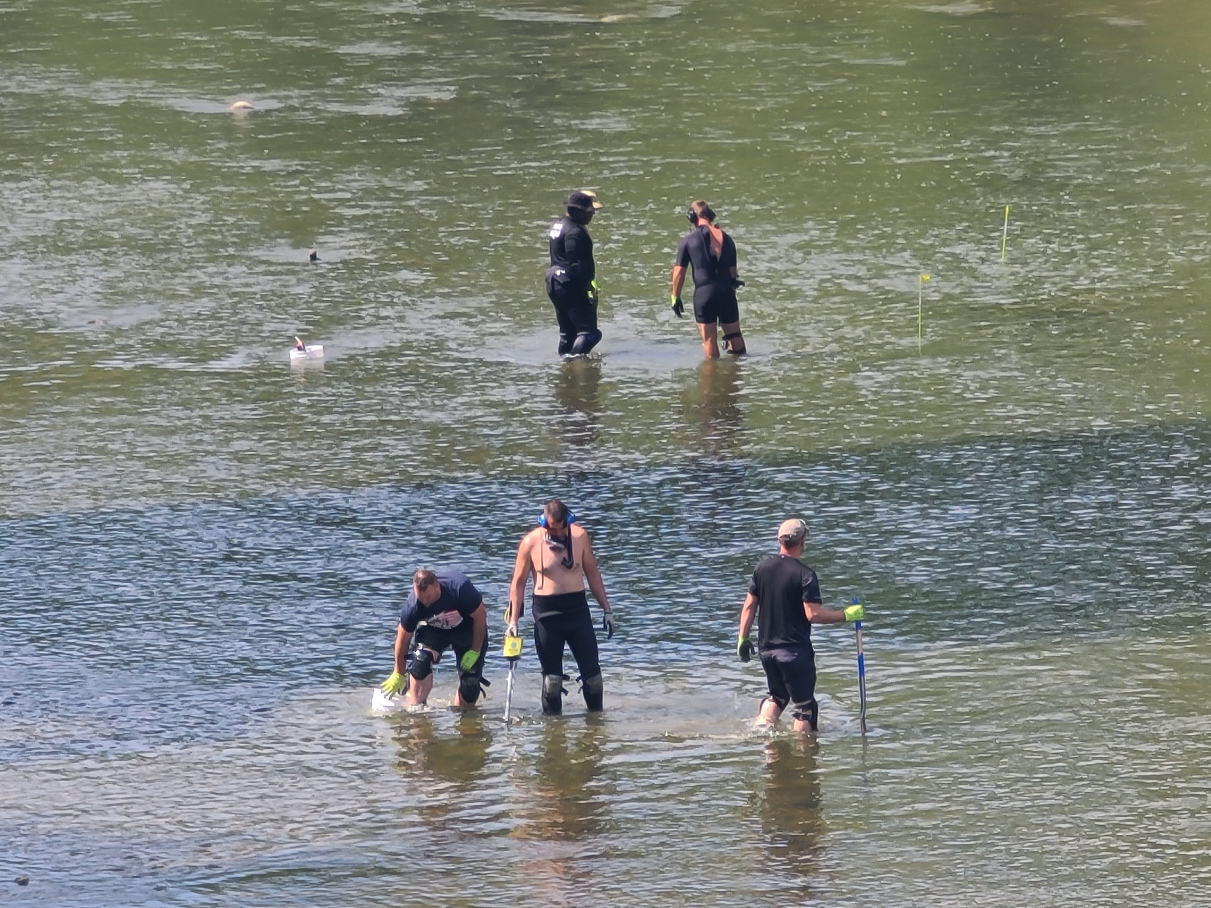 The officers from the Indiana State Police used metal detectors and shovels to search the river