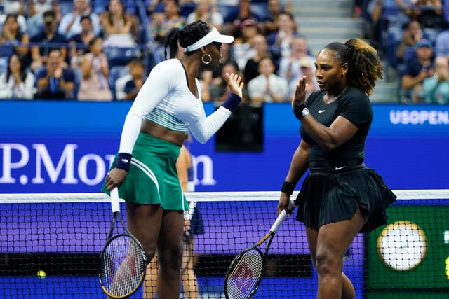 Serena (right) and Venus Williams were beaten on their doubles comeback (Frank Franklin II/AP)