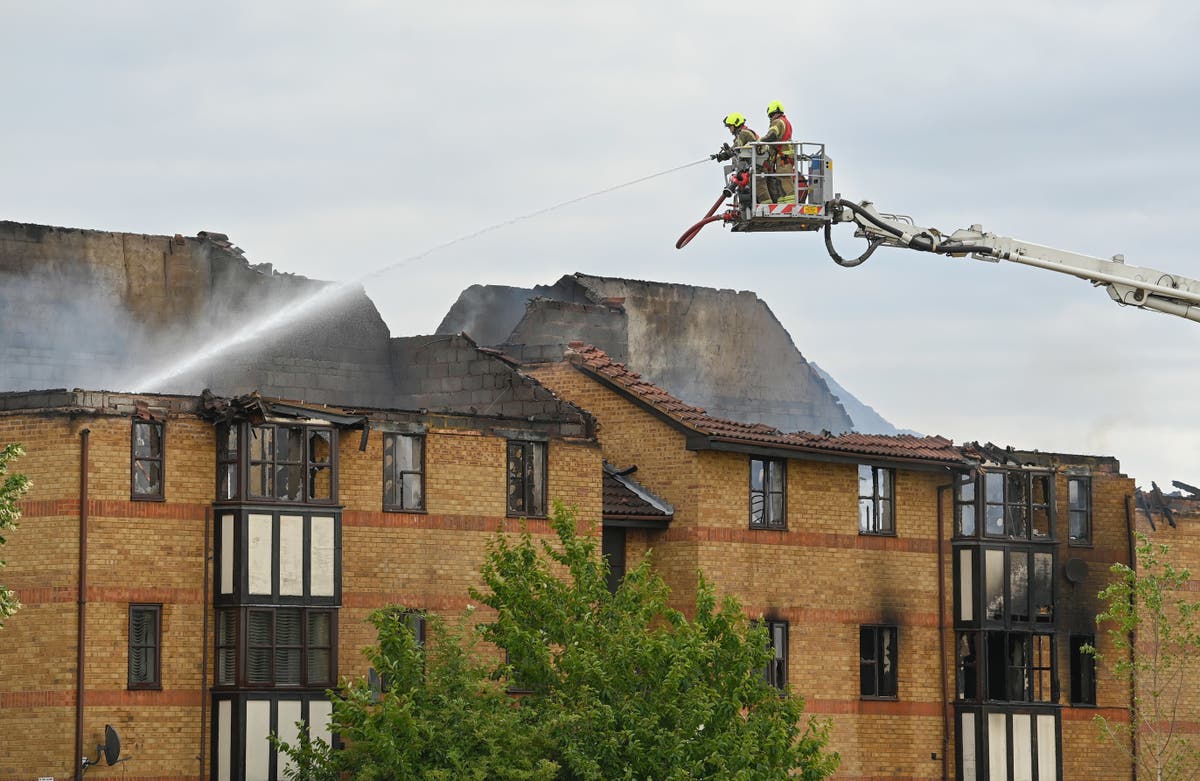 Woman who died after explosion at flats started fire herself, say police