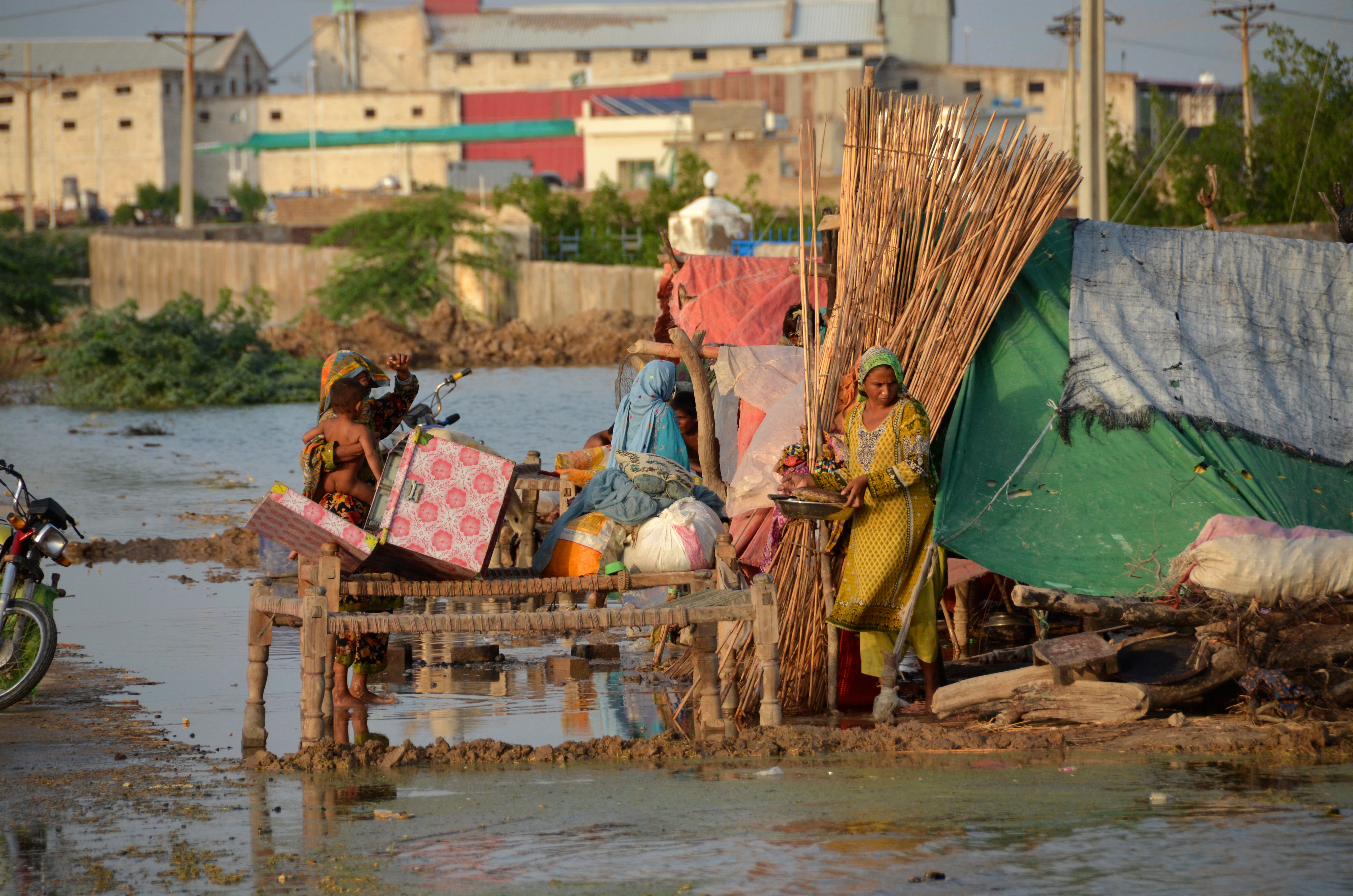 Flash flooding from the heavy rains has washed away villages and crops in Pakistan.