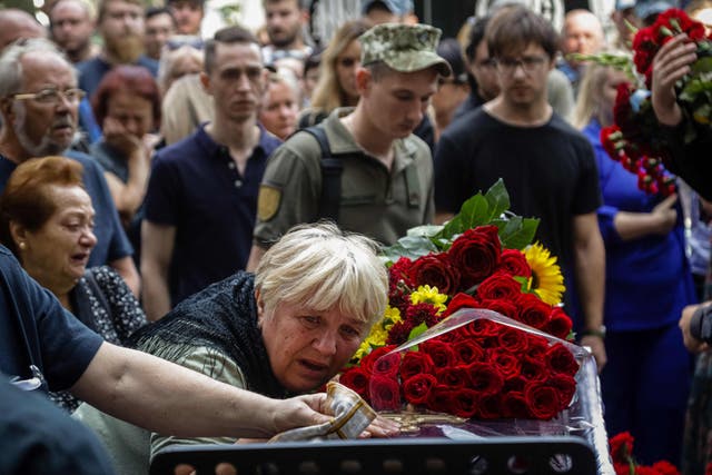 <p>Relatives mourn a slain Ukrainian soldier at a funeral in Odesa on Friday </p>
